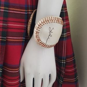 Baseball cuff leather ball with red stitching